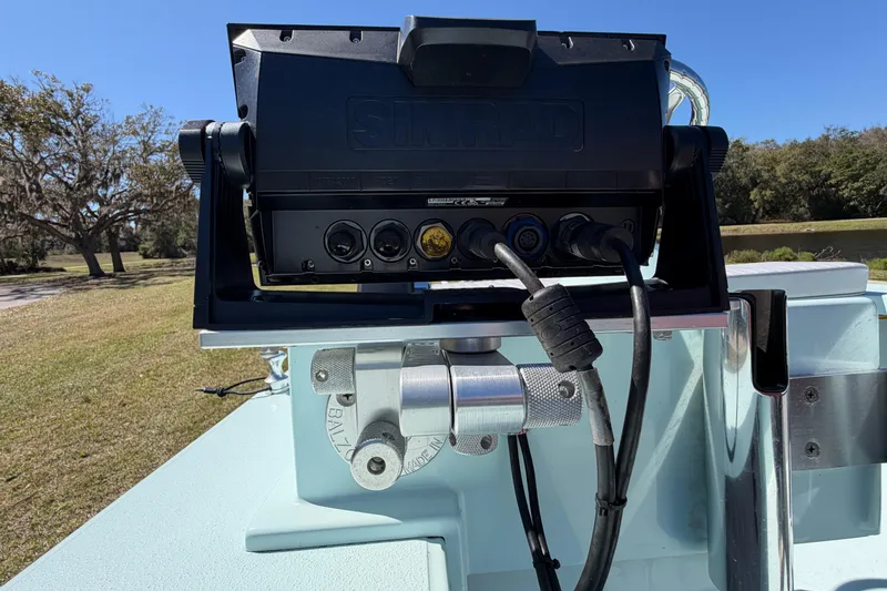 Slide: The Image of Simrad device mounted on 2023 East Cape 18 EVO X boat, outdoor setting. - 46