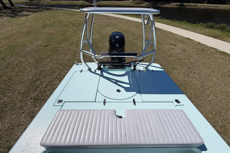 Slide: The Image of 2023 East Cape 18 EVO X boat with sleek design and outboard motor. - 55