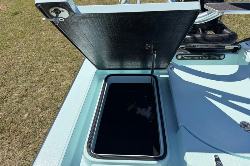 Slide: The Image of Open storage compartment on 2023 East Cape 18 EVO X boat, showcasing interior details. - 66