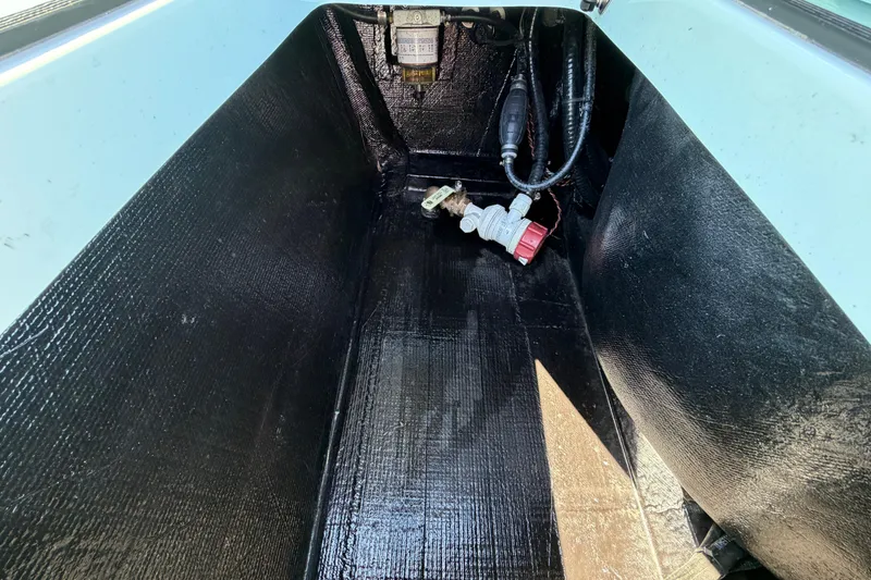 Slide: The Image of Interior view of 2023 East Cape 18 EVO X boat compartment with wiring and fittings. - 67