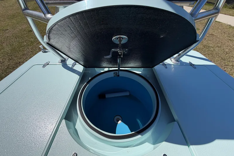 Slide: The Image of Open hatch of 2023 East Cape 18 EVO X boat, revealing interior compartment. - 70