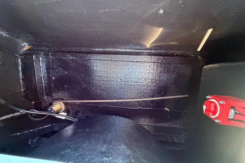 Slide: The Image of Interior view of 2023 East Cape 18 EVO X boat showing wiring and components. - 76