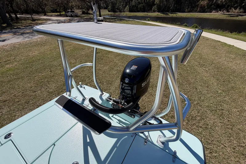 Slide: The Image of 2023 East Cape 18 EVO X boat with Suzuki outboard motor and elevated platform. - 77