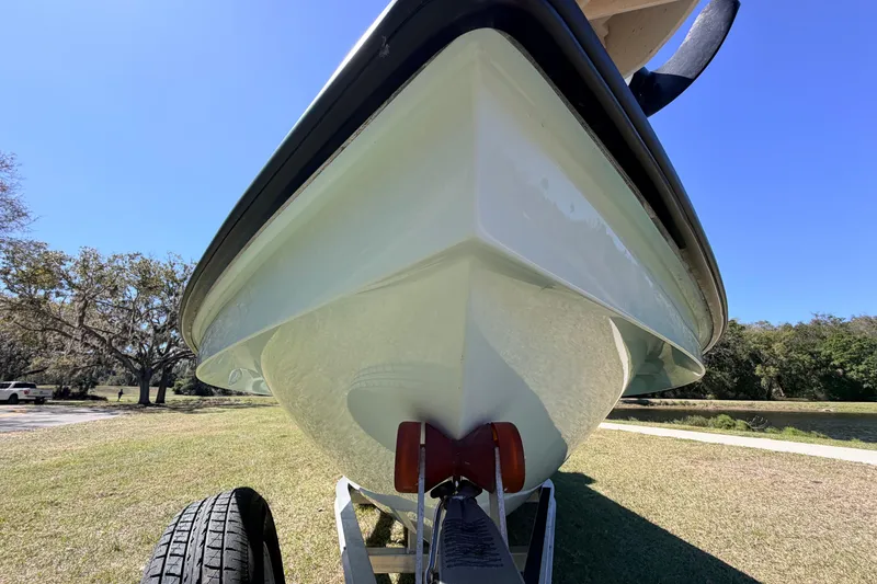 Slide: The Image of 2023 East Cape 18 EVO X boat on trailer, viewed from below, outdoors. - 8