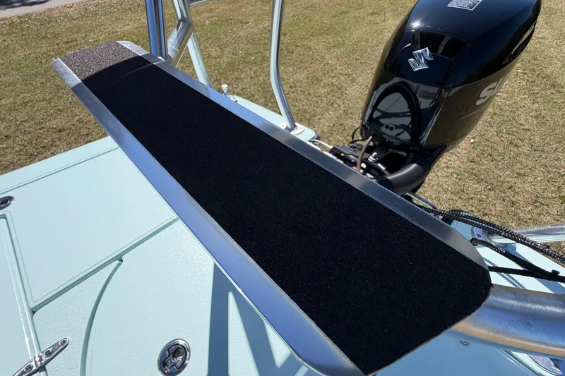 Slide: The Image of 2023 East Cape 18 EVO X boat with Suzuki outboard motor, featuring a non-slip platform. - 82