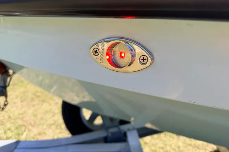 Slide: The Image of 2023 East Cape 18 EVO X boat with illuminated red navigation light. - 83