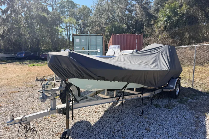Slide: The Image of Covered 2023 East Cape 18 EVO X boat on trailer in outdoor storage area. - 86
