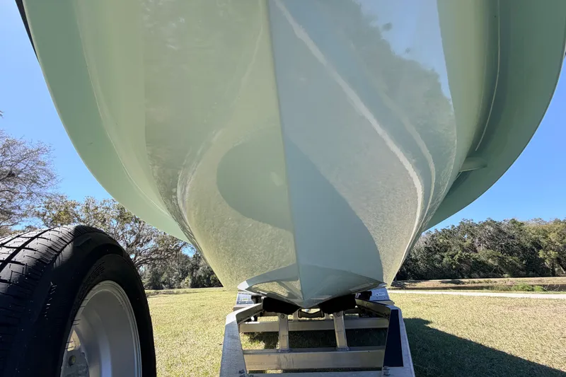 Slide: The Image of 2023 East Cape 18 EVO X boat hull on trailer, side view. - 9