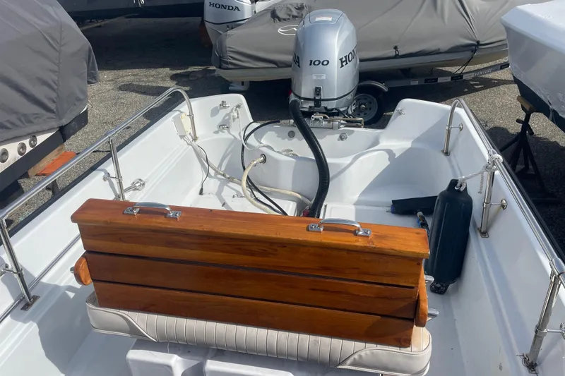 Slide: The Image of 1987 Boston Whaler 17 Montauk boat interior with Honda outboard motor. - 3