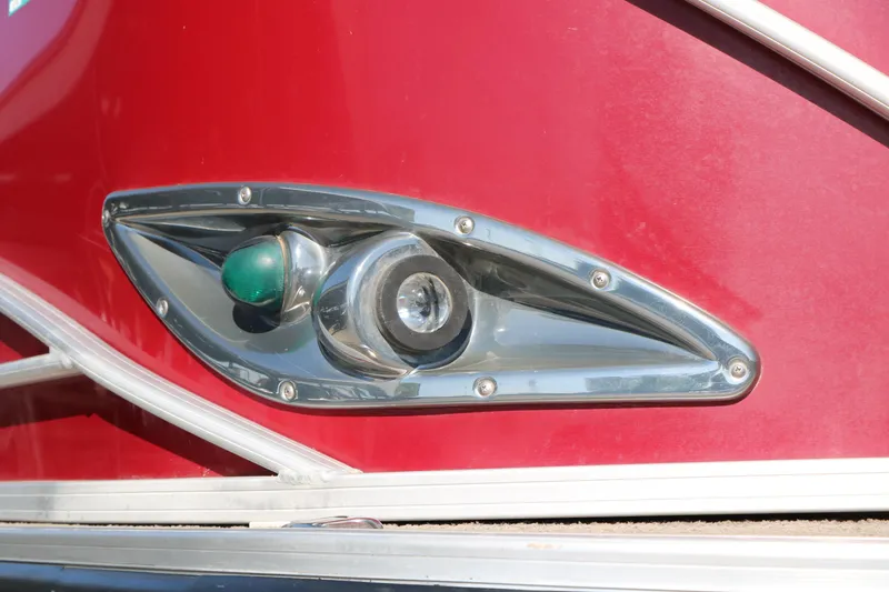 Slide: The Image of Close-up of a 2014 Regency Party Barge 254 XP3 navigation light on red hull. - 16