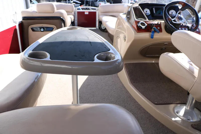 Slide: The Image of 2014 Regency Party Barge 254 XP3 interior with seating and control panel. - 33