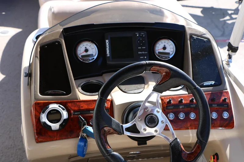 Slide: The Image of Steering console of 2014 Regency Party Barge 254 XP3 with gauges and controls. - 35