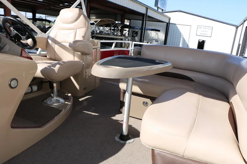 Slide: The Image of 2014 Regency Party Barge 254 XP3 interior with beige seating and table. - 40