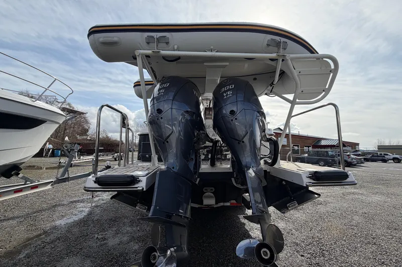 Slide: The Image of 2023 Cutwater C-32 Coupe with dual 300 V6 outboard engines, rear view. - 3