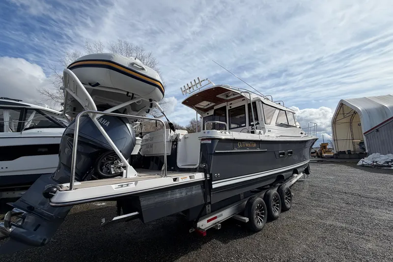 Slide: The Image of 2023 Cutwater C-32 Coupe boat on trailer, featuring Yamaha outboard motor. - 5
