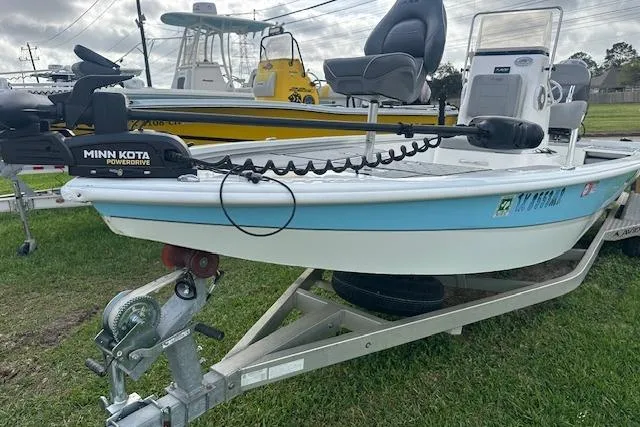 Slide: The Image of 2021 Avid 21 Mag boat on trailer with Minn Kota PowerDrive motor. - 13