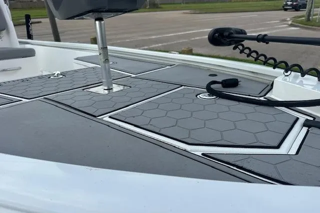 Slide: The Image of 2021 Avid 21 Mag boat deck with hexagonal pattern and mounted equipment. - 9