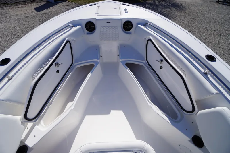Slide: The Image of 2026 Tidewater 232 CC Adventure boat interior with spacious storage compartments. - 15