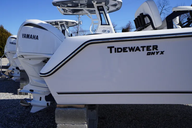 Slide: The Image of 2026 Tidewater 232 CC Adventure boat with Yamaha engines, displayed outdoors. - 3