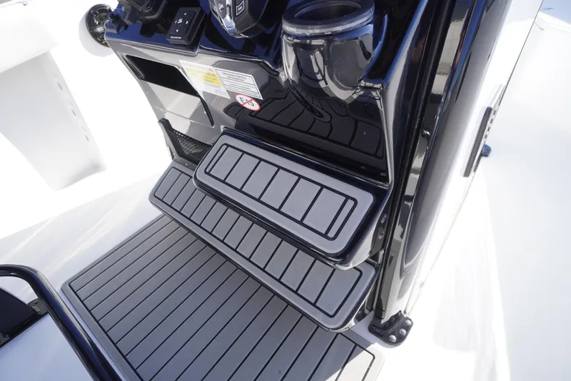 Slide: The Image of 2026 Tidewater 232 CC Adventure boat console with sleek, modern design and cup holders. - 31