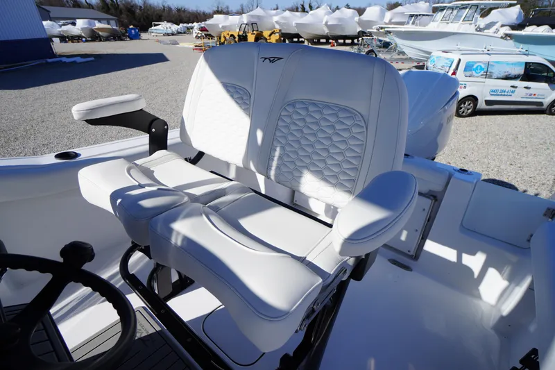 Slide: The Image of 2026 Tidewater 232 CC Adventure boat with luxurious white seating and armrests. - 36