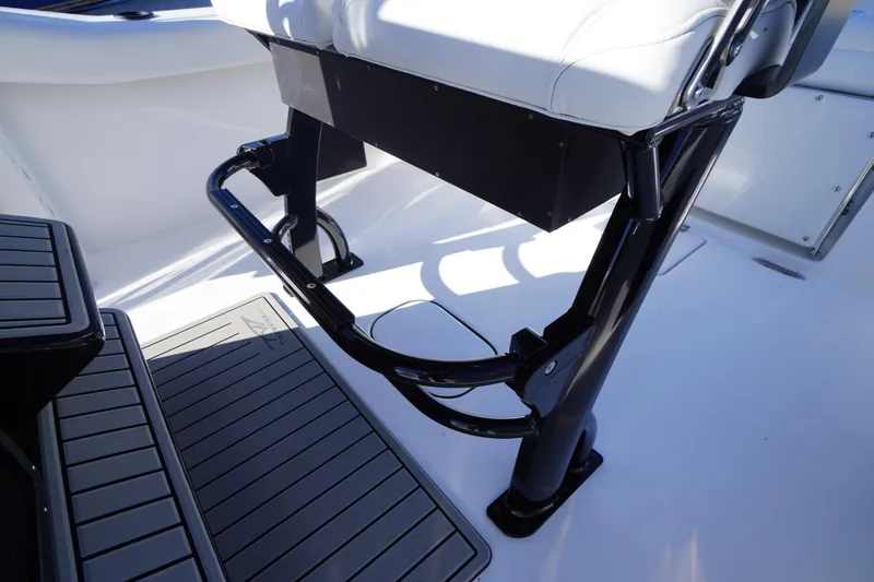 Slide: The Image of 2026 Tidewater 232 CC Adventure boat interior with seating and step detail. - 39