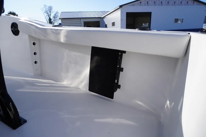 Slide: The Image of 2026 Tidewater 232 CC Adventure boat interior detail with storage compartment. - 44