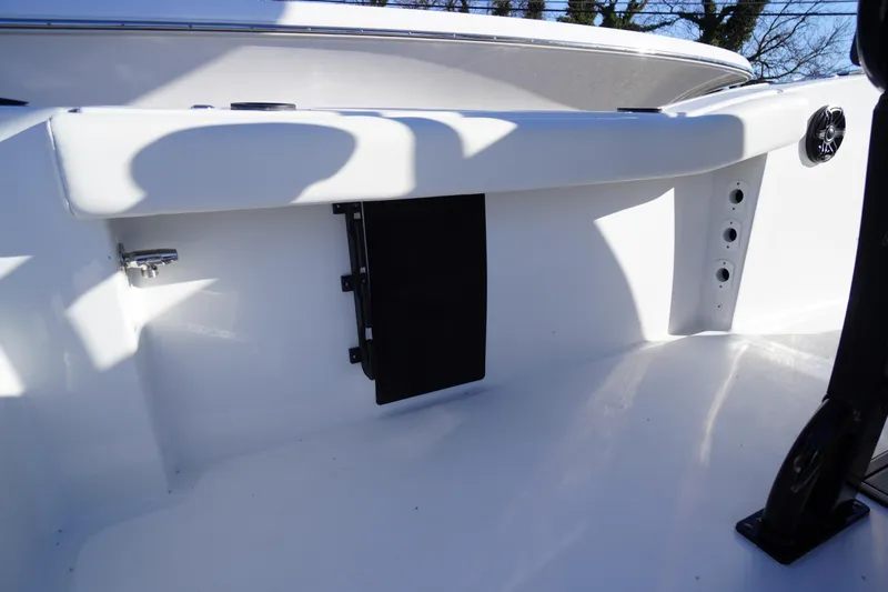 Slide: The Image of 2026 Tidewater 232 CC Adventure boat interior detail, featuring sleek white design and modern fixtures. - 46