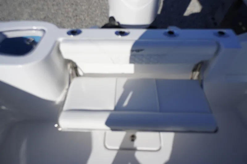 Slide: The Image of 2026 Tidewater 232 CC Adventure boat seat detail, featuring sleek white design. - 48
