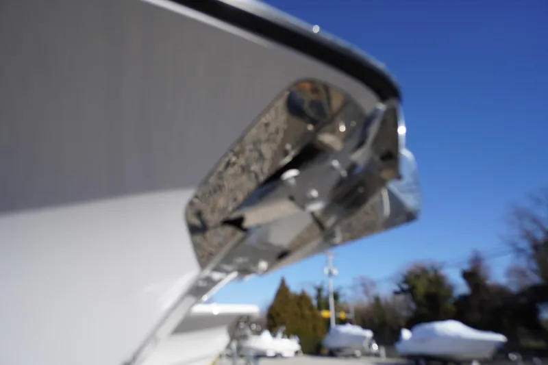 Slide: The Image of Close-up of 2026 Tidewater 232 CC Adventure boat's bow with a clear blue sky. - 5