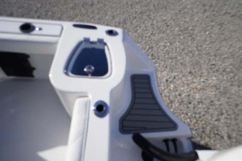 Slide: The Image of 2026 Tidewater 232 CC Adventure boat interior detail with storage compartment. - 50