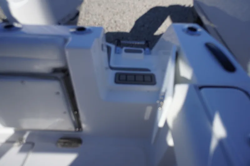 Slide: The Image of Interior view of 2026 Tidewater 232 CC Adventure boat, featuring seating and controls. - 54