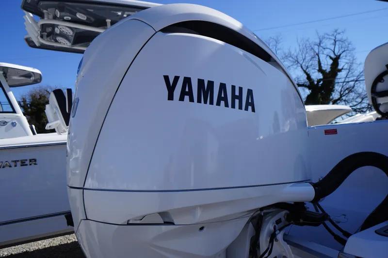 Slide: The Image of Yamaha outboard motor on 2026 Tidewater 232 CC Adventure boat, sunny day. - 58