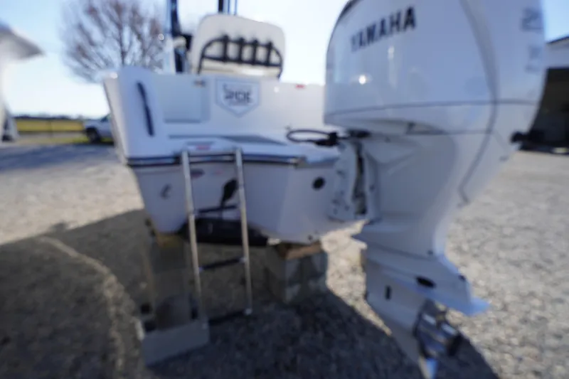 Slide: The Image of Blurry image of a 2026 Tidewater 232 CC Adventure boat with Yamaha engine. - 63