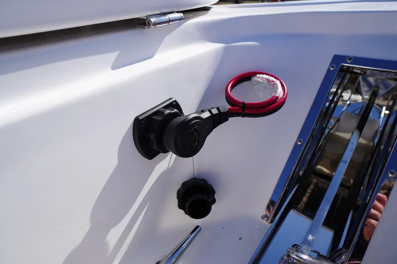 Slide: The Image of Close-up of 2026 Tidewater 232 CC Adventure boat's control panel with red safety lanyard. - 8