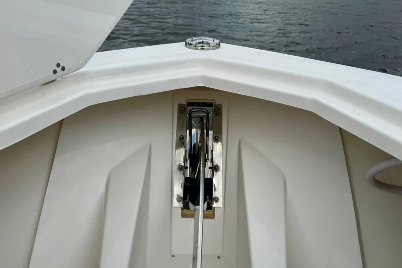 Slide: The Image of Bow view of 2020 Pursuit S 408 Sport boat with anchor mechanism. - 15