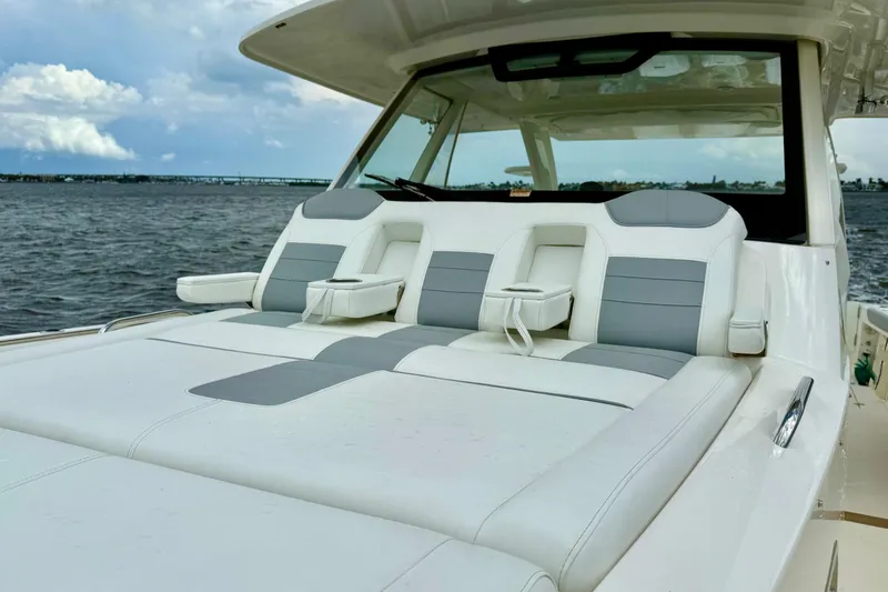 Slide: The Image of 2020 Pursuit S 408 Sport boat with luxurious seating on open water. - 19