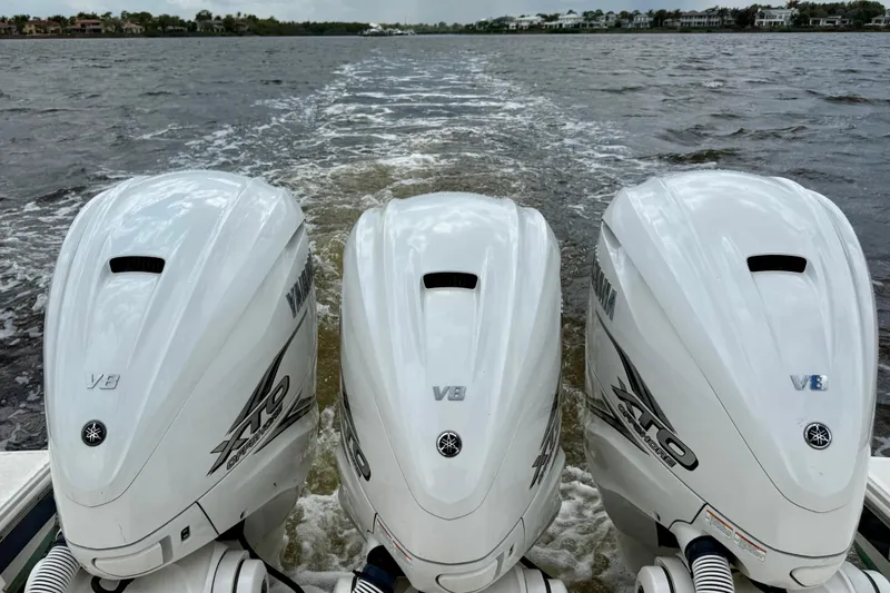 Slide: The Image of Triple Yamaha V8 outboard engines on a 2020 Pursuit S 408 Sport boat. - 25