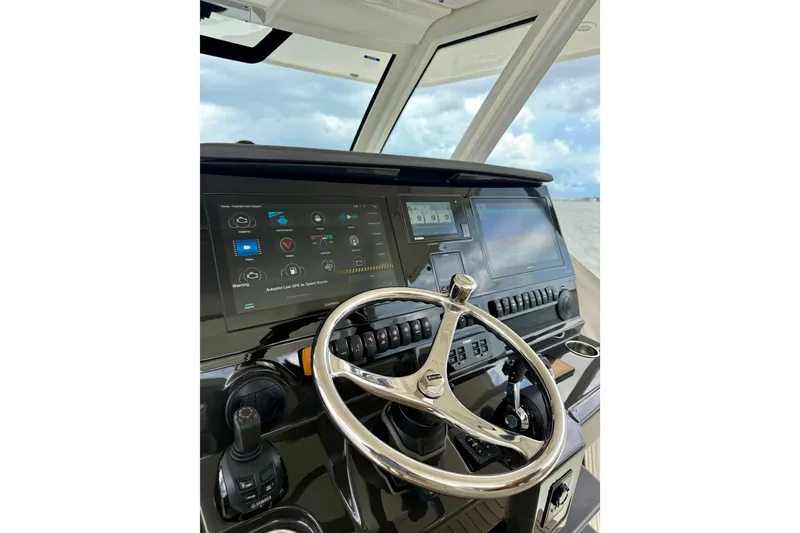 Slide: The Image of Helm of 2020 Pursuit S 408 Sport boat with advanced navigation displays. - 5