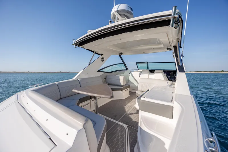 Slide: The Image of 2024 Sea Ray Sundancer 320 Outboard, luxurious deck view on open water. - 15