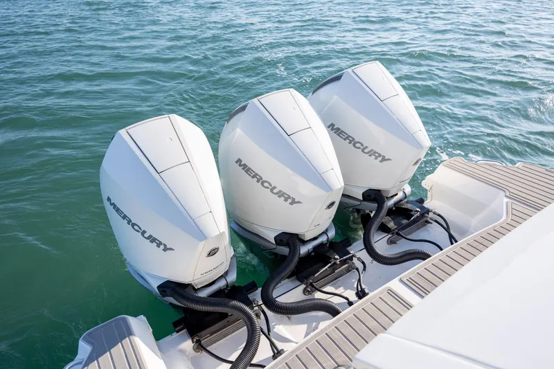 Slide: The Image of 2024 Sea Ray Sundancer 320 Outboard cockpit with modern controls and ocean view. - 22