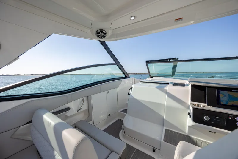 Slide: The Image of 2024 Sea Ray Sundancer 320 Outboard interior with luxurious seating and ocean view. - 28