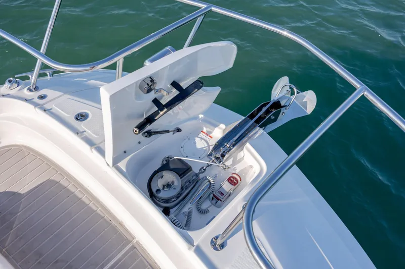 Slide: The Image of 2024 Sea Ray Sundancer 320 Outboard interior with modern seating and sleek cabinetry. - 36
