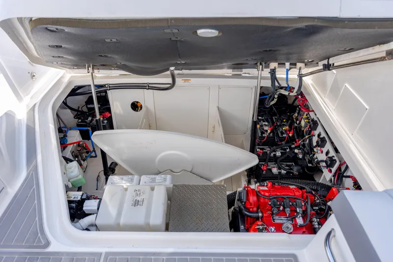 Slide: The Image of 2024 Sea Ray Sundancer 320 Outboard cabin interior with modern seating and lighting. - 37