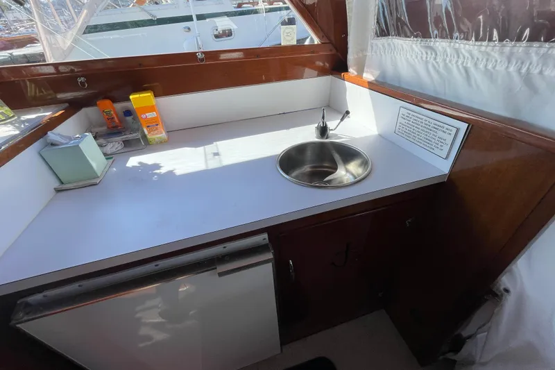 Slide: The Image of 1967 Lyman Islander 30 boat interior with sink and countertop. - 17