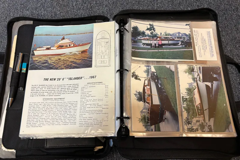 Slide: The Image of Binder with 1967 Lyman Islander 30 brochure and vintage boat photographs. - 38