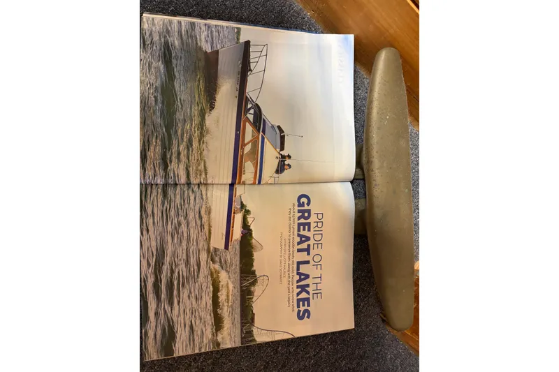 Slide: The Image of 1967 Lyman Islander 30 boat on Great Lakes, featured in a magazine spread. - 40