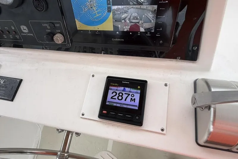 Slide: The Image of Control panel of a 2005 Kadey-Krogen 44 yacht with navigation instruments. - 19
