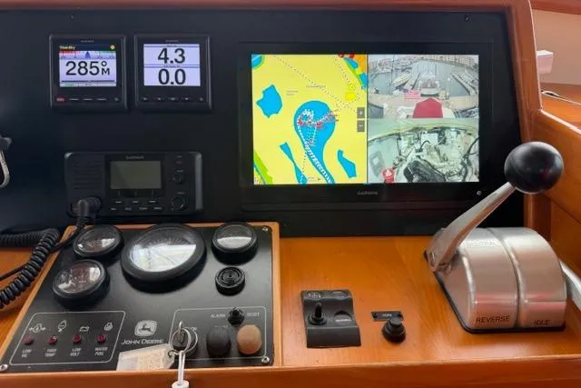 Slide: The Image of Kadey-Krogen 44 yacht dashboard with navigation screens and controls, 2005 model. - 20