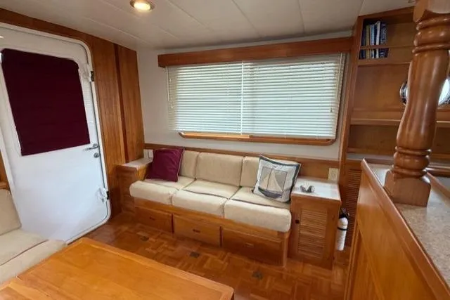 Slide: The Image of Cozy interior of 2005 Kadey-Krogen 44 yacht with wooden furnishings and comfortable seating. - 24